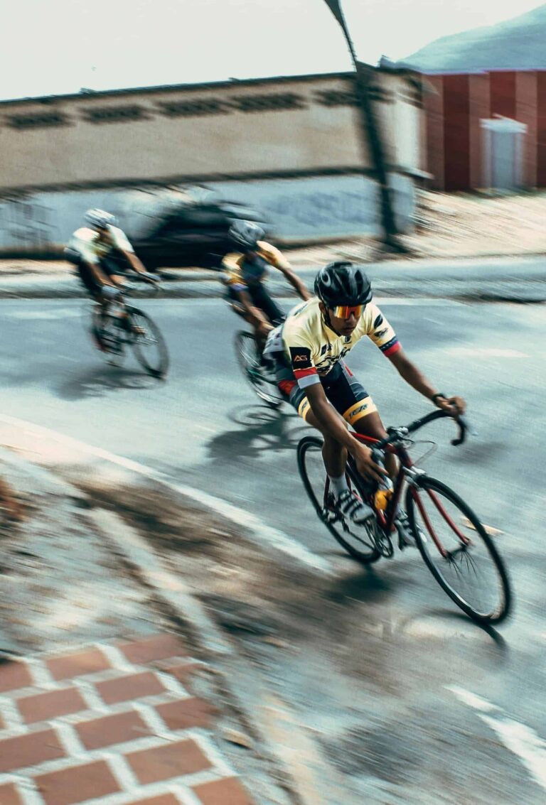 Tour de France cyclists racing through the French countryside at high speed