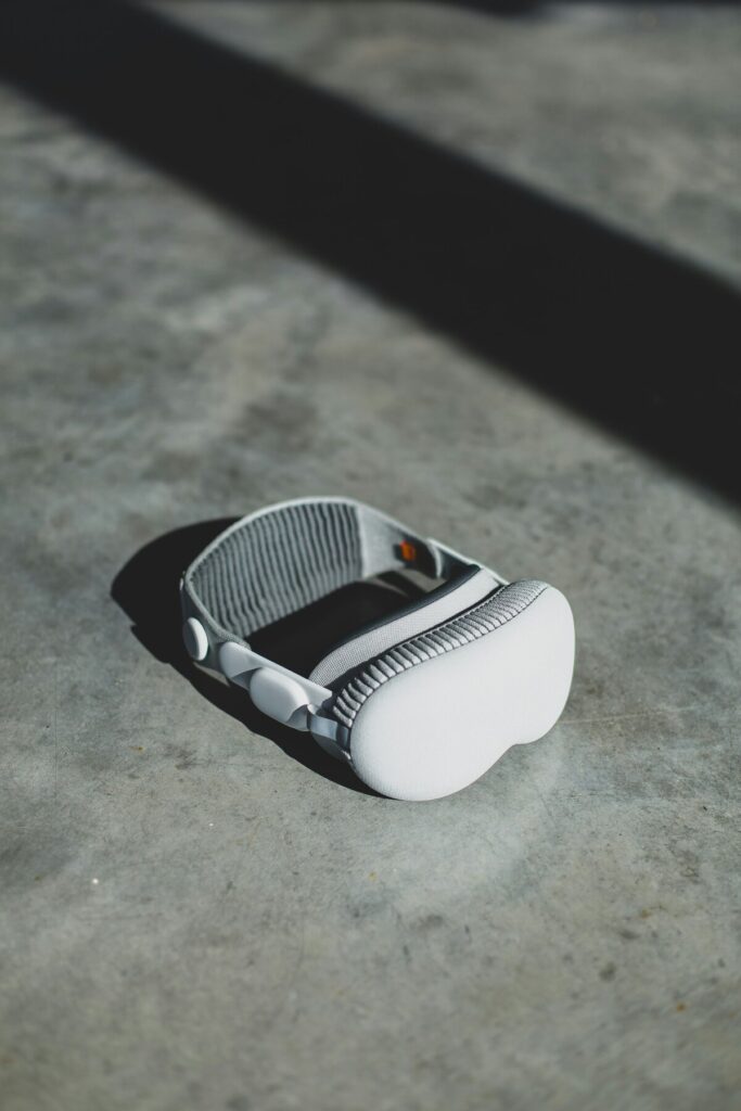 Apple Vision Pro Preview components laid out aesthetically on marble surface with luxury accessories fashion magazine photography style