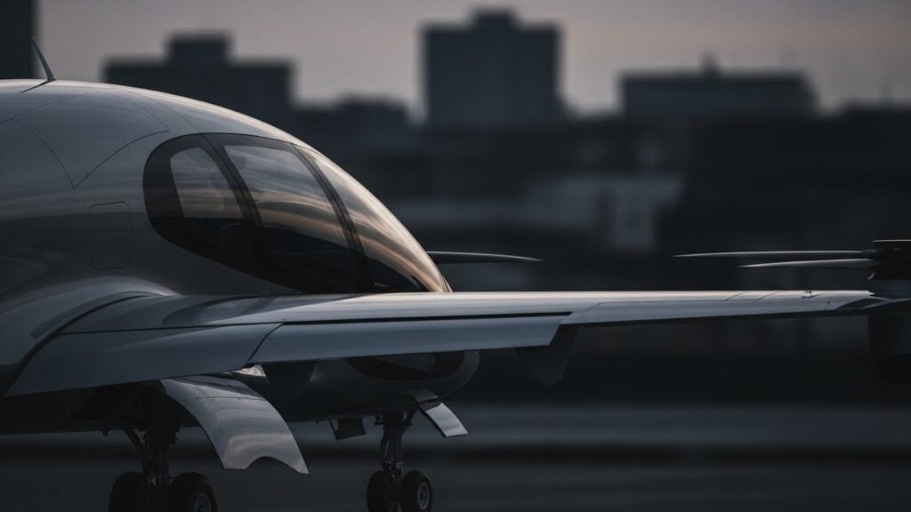 Osaka OSAKAKO eVTOL vertiport with SkyDrive electric aircraft landing showing urban air mobility infrastructure at Expo 2025 Japan