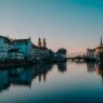 Zurich Switzerland panorama showing Lake Zurich Old Town medieval architecture Swiss Alps mountains background