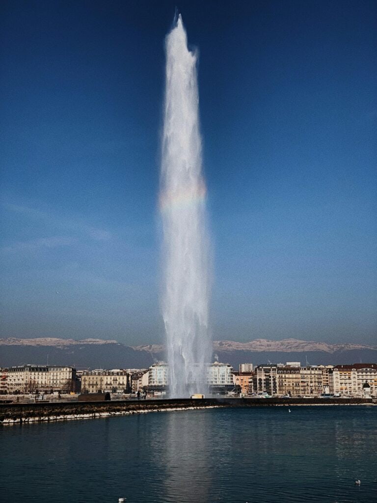 Geneva Switzerland Lake Geneva with Jet d'Eau fountain and Mont Blanc mountain view international city