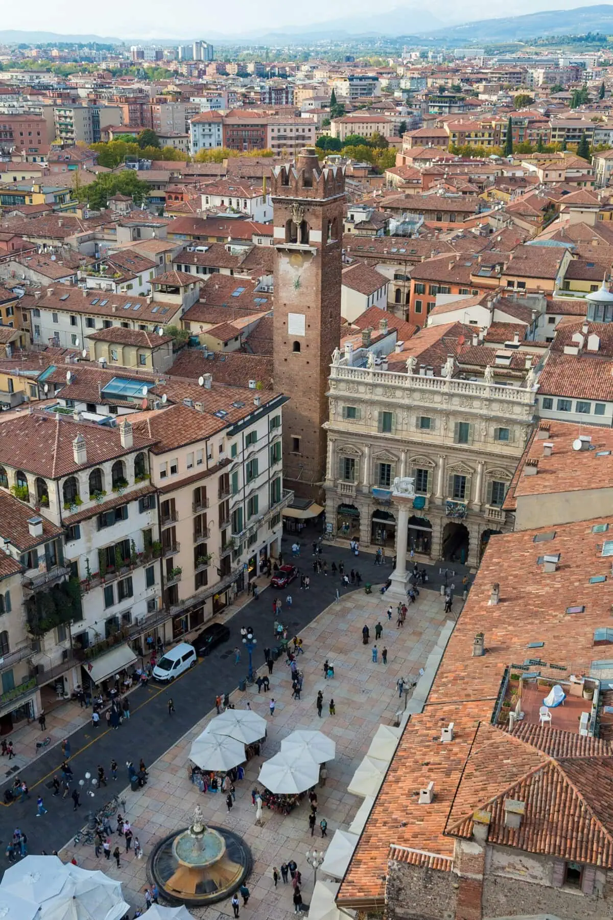 Piazza delle Erbe Verona medieval square market historic buildings Torre dei Lamberti Italy